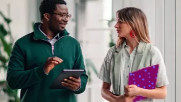 two co-workers talking