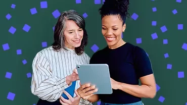 Two people looking at a tablet together with decorative blue confetti shapes in the background.