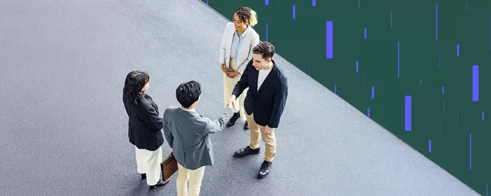Overhead view of professionals shaking hands in a modern office setting