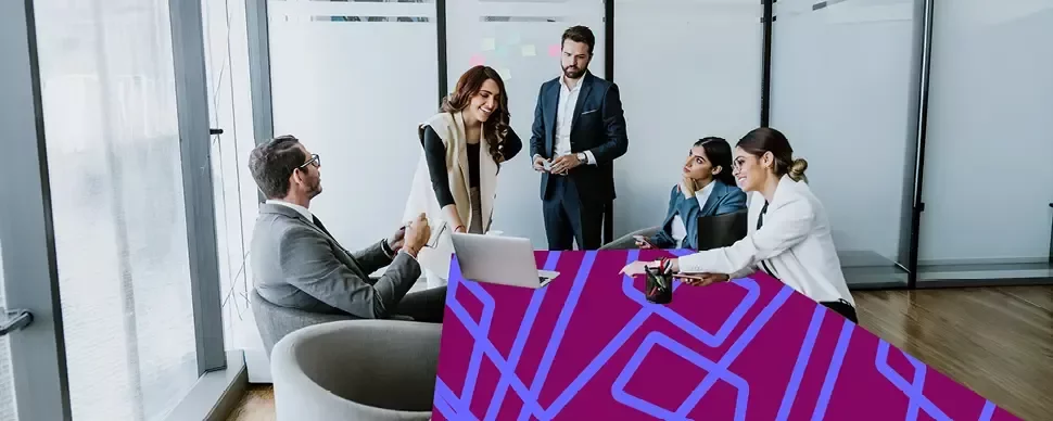 Professionals collaborating during a meeting in a modern office.